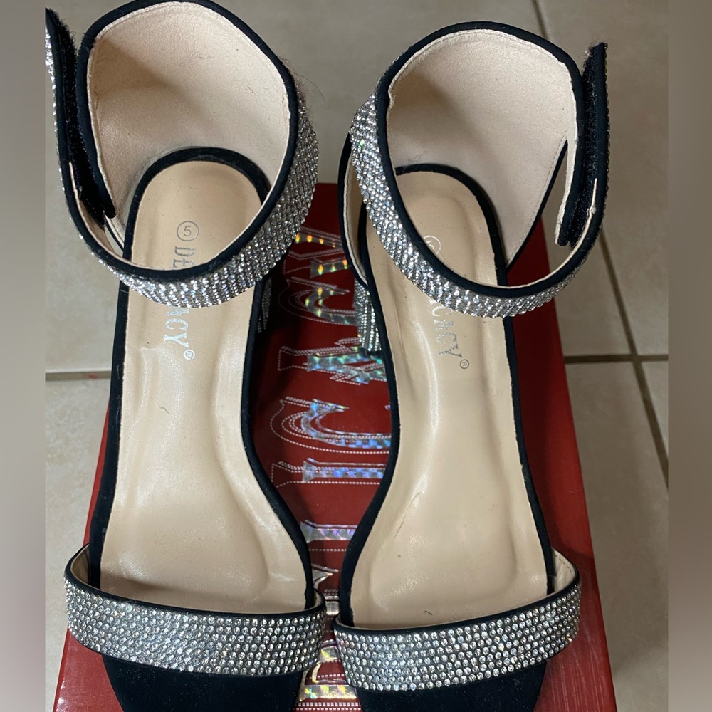 Black dress shoes with rhinestones.